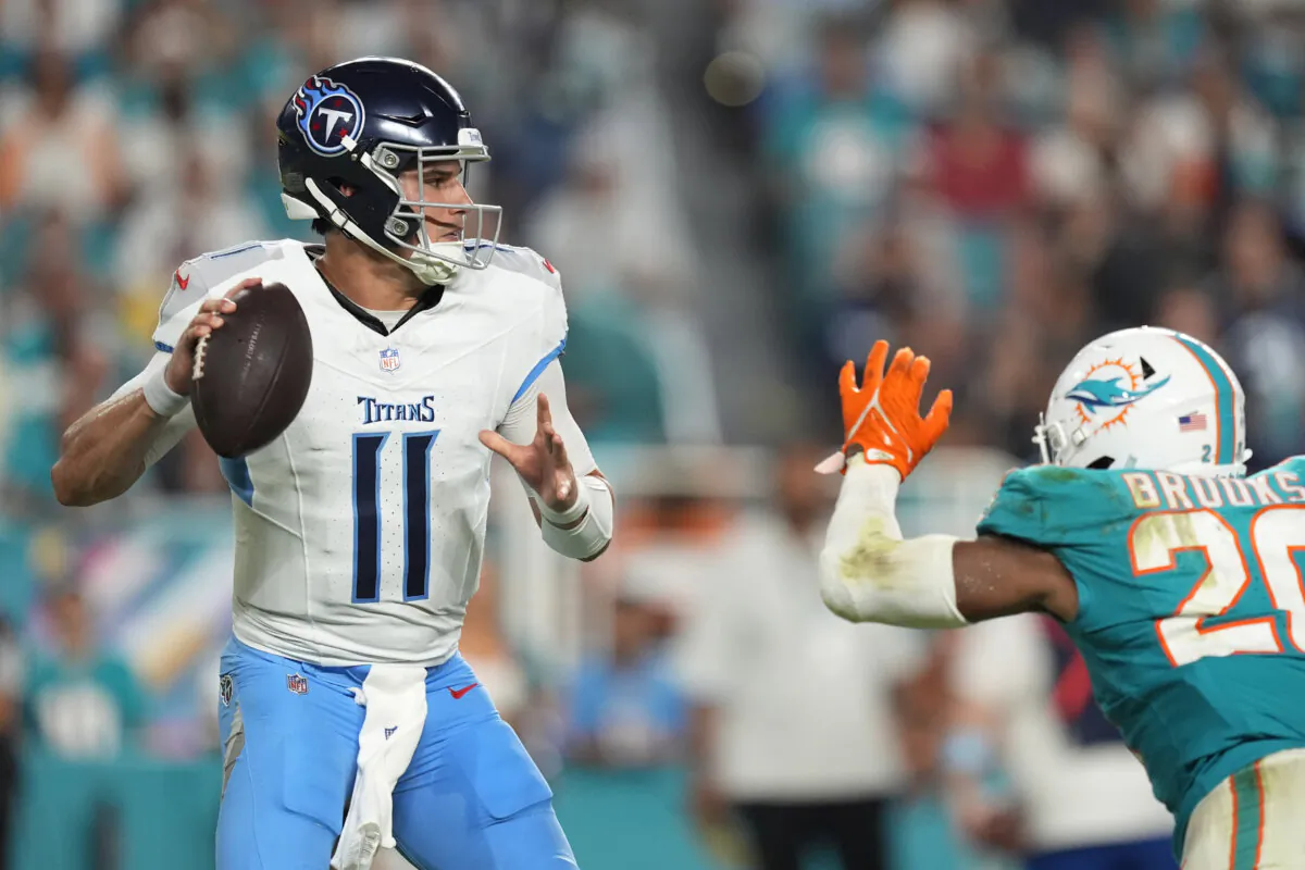 Tennessee Titans quarterback Mason Rudolph (11) aims a pass during the second half of an NFL football game against the Miami Dolphins in Miami Gardens, Fla., on Sept. 30, 2024. (Rebecca Blackwell/AP Photo)