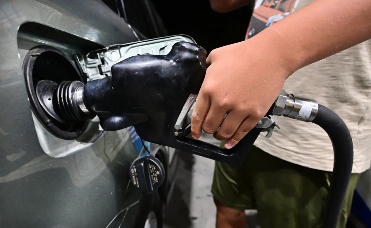 A man pumps gas at a filling station in Alhambra, Calif., on Oct. 2, 2023. (Frederic J. Brown/AFP via Getty Images)