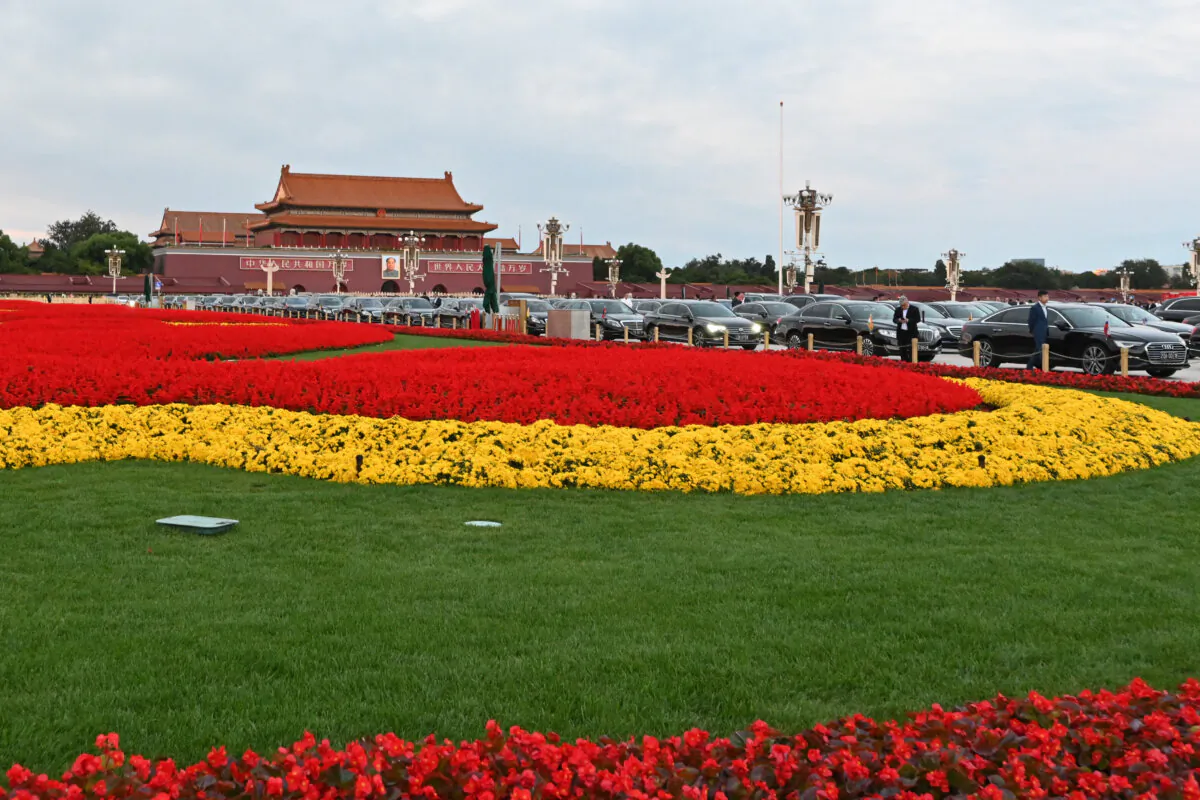 Tiananmen Gate is seen in the background past cars of dignitaries attending a National Day reception on the eve of the 75th anniversary of the the founding of communist China, in Beijing on Sept. 30, 2024. (Adek Berry/AFP via Getty Images)