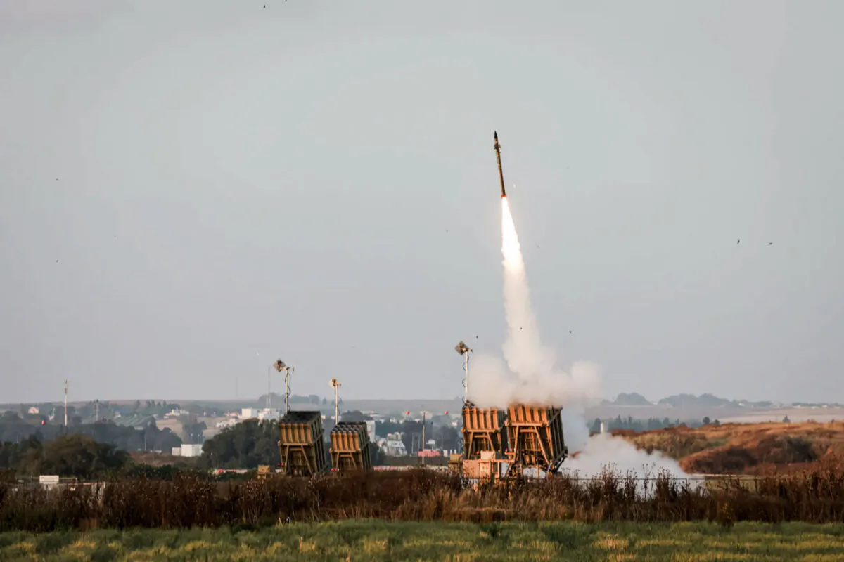 Israeli military forces fire rockets from the Iron Dome defense system to intercept rockets launched from the Gaza Strip, near Sderot, on May 13, 2023. (Menahem Kahana/AFP via Getty Images)