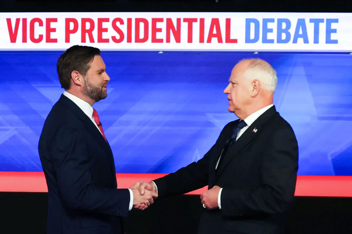 Sen. JD Vance (L) and Minnesota Gov. Tim Walz (R) shake hands at the start of the vice presidential debate at the CBS Broadcast Center in New York, on Oct. 1, 2024. (Charly Triballeau/AFP via Getty Images)
