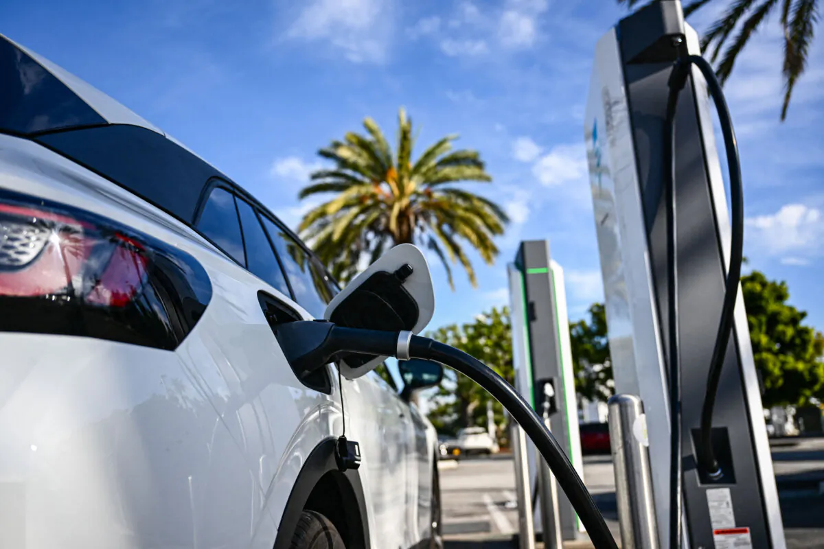 An electric vehicle charges at a mall parking lot in Torrance, Calif., on Feb. 23, 2024. (Patrick T. Fallon/AFP via Getty Images)
