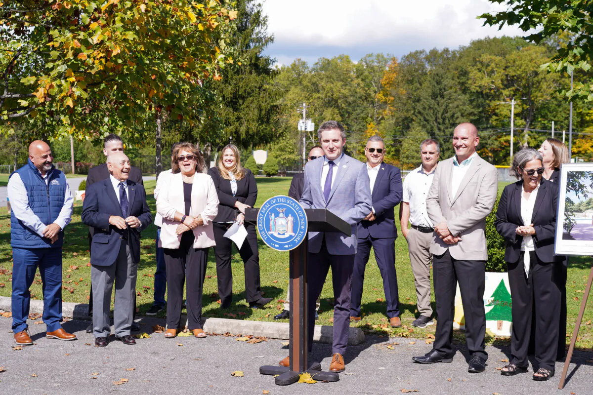New York Sen. James Skoufis, flanked by town officials, announced new funding for local water recreation facilities in Goshen, N.Y., on Oct. 1, 2024. (Cara Ding/The Epoch Times)