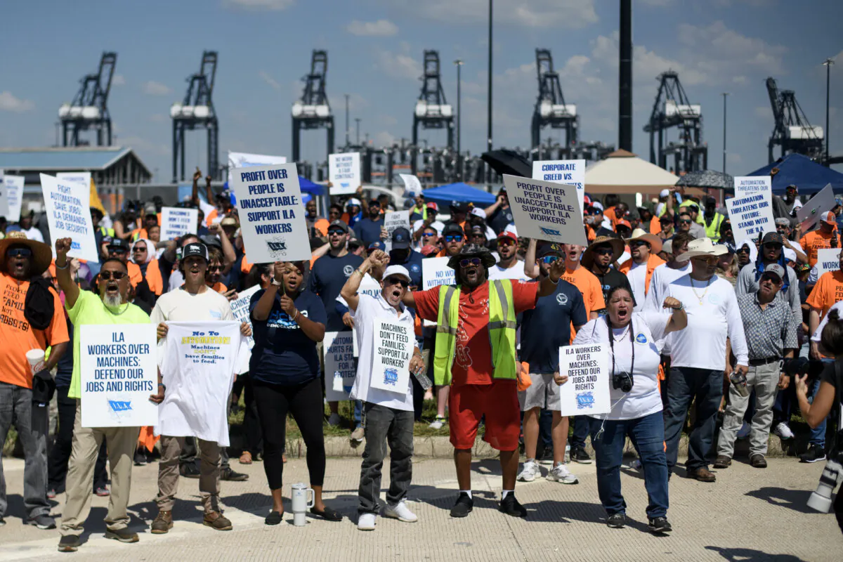 Dockworkers gather at the Bayport Container Terminal in Seabrook, Texas, on Oct. 1, 2024. (Mark Felix/AFP via Getty Images)