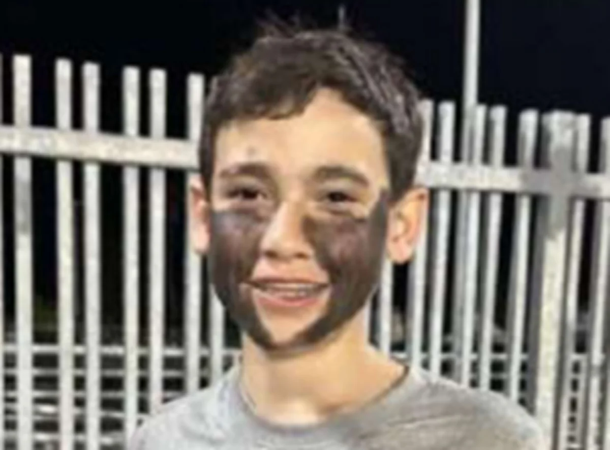 J.A. wearing black paint on his face during a football game in California. (U.S. District Court via The Epoch Times)