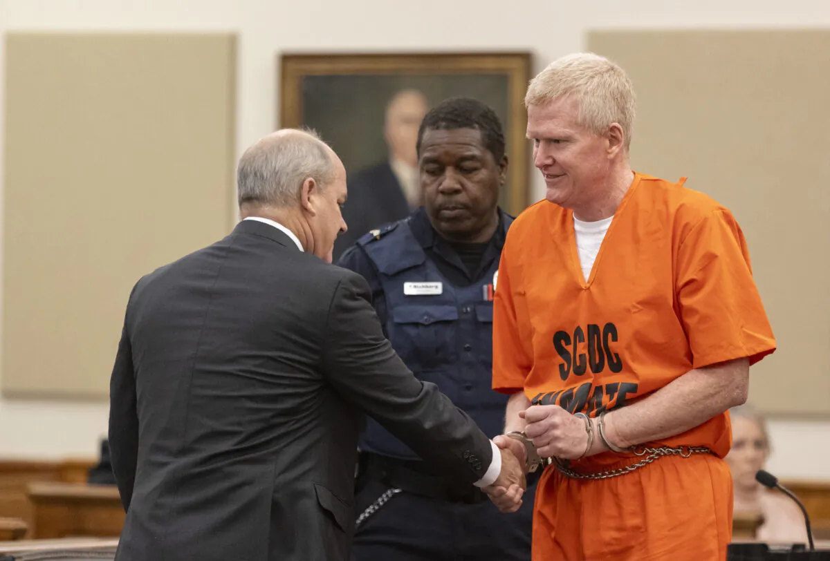 Alex Murdaugh shakes hands with his attorney Jim Griffin during his sentencing for stealing from 18 clients, Nov. 28, 2023, at the Beaufort County Courthouse in Beaufort, S.C. (Andrew J. Whitaker/The Post And Courier via AP, Pool)