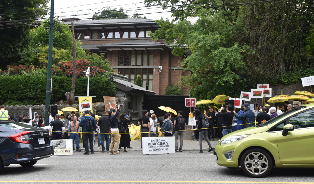 Pro-Hong Kong democracy activists gather in front of the Chinese Consulate in Vancouver on June 9, 2019. (Don Mackinnon/AFP via Getty Images)