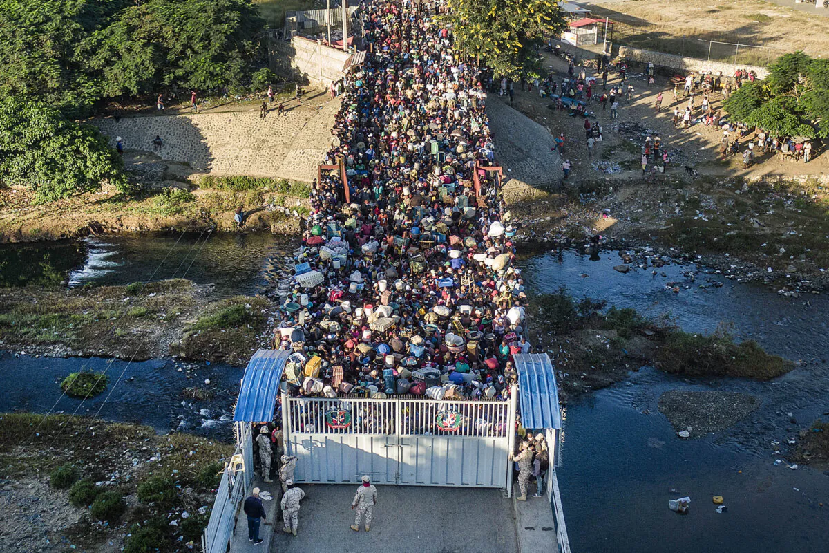 Haitians wait to cross the border from Haiti into the Dominican Republic in Dajabon, Dominican Republic, on Nov. 19, 2021. (Matias Delacroix/AP Photo)