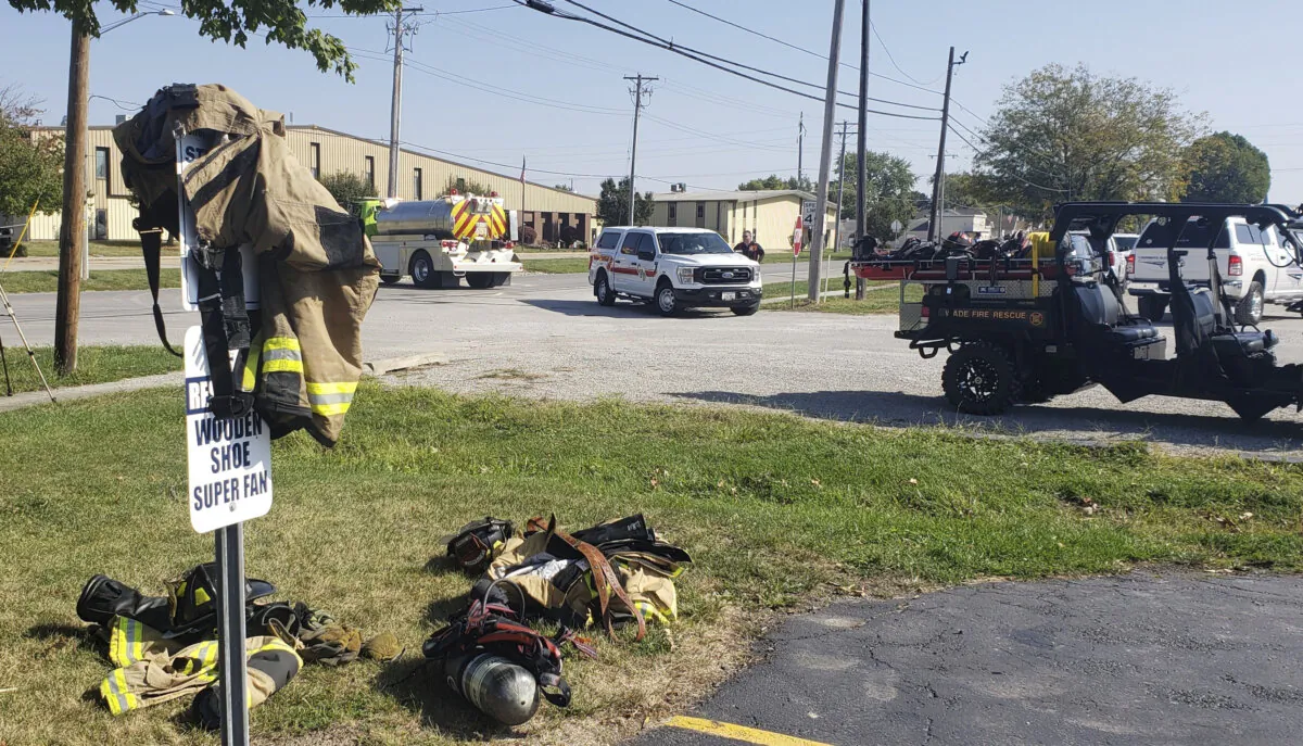 Emergency responders set up a staging area near Teutopolis High School in Teutopolis, Ill., on Sept. 30, 2023. (Jeff Long/Effingham Daily News via AP)
