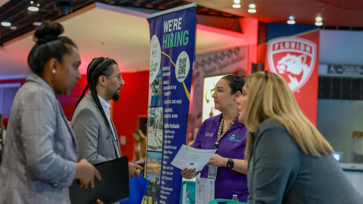 Companies look to hire new employees at a job fair in south Florida. (Joe Raedle/Getty Images)