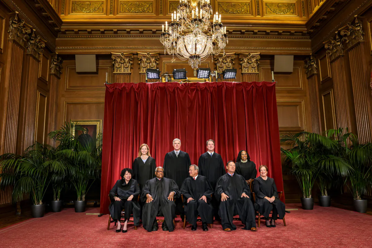 (L–R) U.S. Supreme Court Associate Justices Sonia Sotomayor, Amy Coney Barrett, Clarence Thomas, and Neil Gorsuch, Chief Justice John Roberts, Associate Justices Brett Kavanaugh, Samuel Alito, Ketanji Brown Jackson, and Elena Kagan pose for their official portrait in the East Conference Room of the Supreme Court in Washington on Oct. 7, 2022. (Alex Wong/Getty Images)