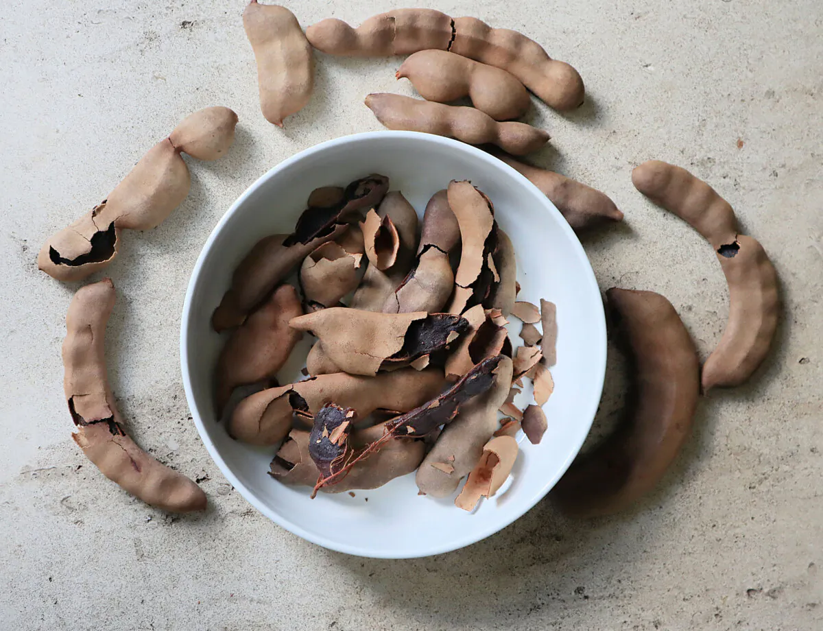 Tamarind is a soft and sticky tropical fruit that grows inside a husky brown pod. Its sweet-and-sour pulp is used in both sweet and savory dishes. (Gretchen McKay/Pittsburgh Post-Gazette/TNS)