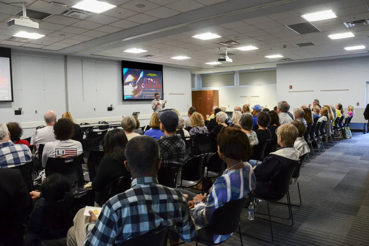 Dozens gather at Lewes Public Library in Lewes, Del., on Oct. 3, 2024, for the screening of State Organs, a documentary exposing forced organ harvesting in China. (Frank Liang/The Epoch Times)