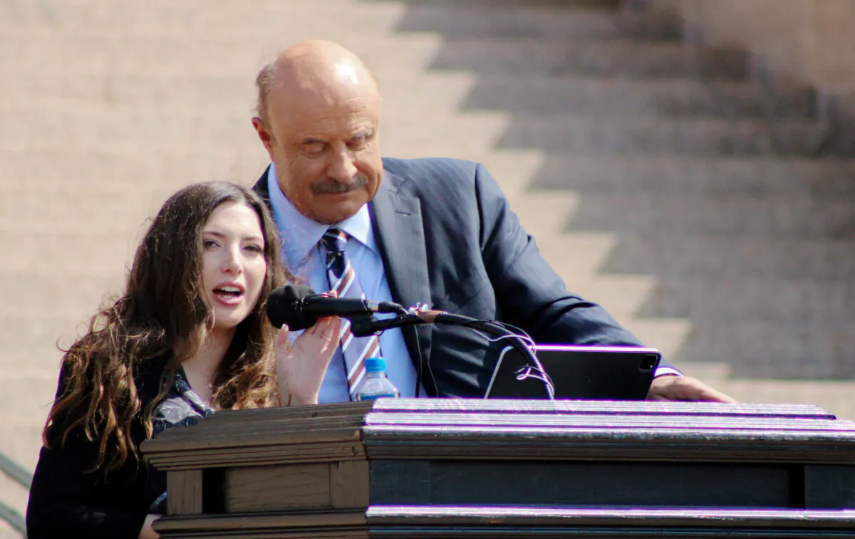 Lea Glossip, wife of Oklahoma death row inmate Richard Glossip and television personality Dr. Phil McGraw address a May 9, 2023, rally at the state capitol in Oklahoma City. (Michael Clements/The Epoch Times)