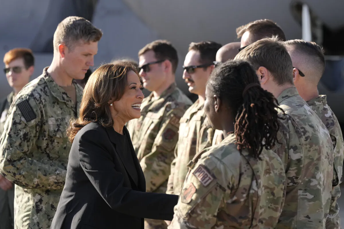 Democratic presidential nominee Vice President Kamala Harris greets members of the military near a C-17 cargo plane after receiving a briefing on the damage from Hurricane Helene, at the North Carolina Air National Guard in Charlotte, N.C., on Oct. 5, 2024,. (Chris Carlson/AP Photo)