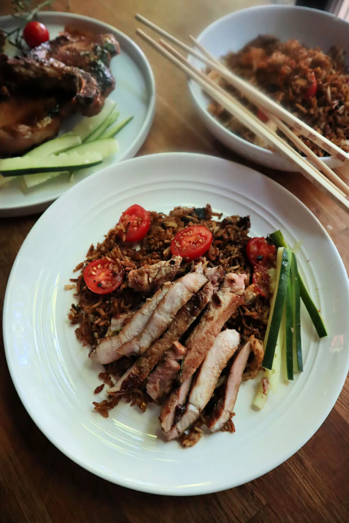 These caramelized, pan-fried pork chops are made in the same cast-iron pan as the fried rice. (Gretchen McKay/Pittsburgh Post-Gazette/TNS)
