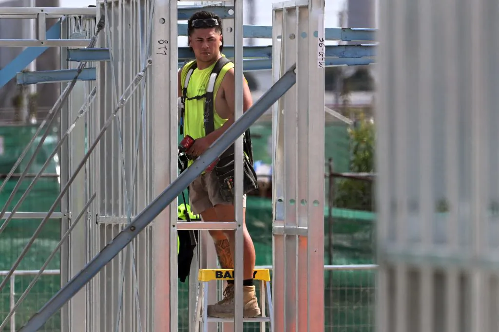 A man works on a construction site building new apartments in Melbourne, Australia on April 4, 2023. (William West/AFP via Getty Images)