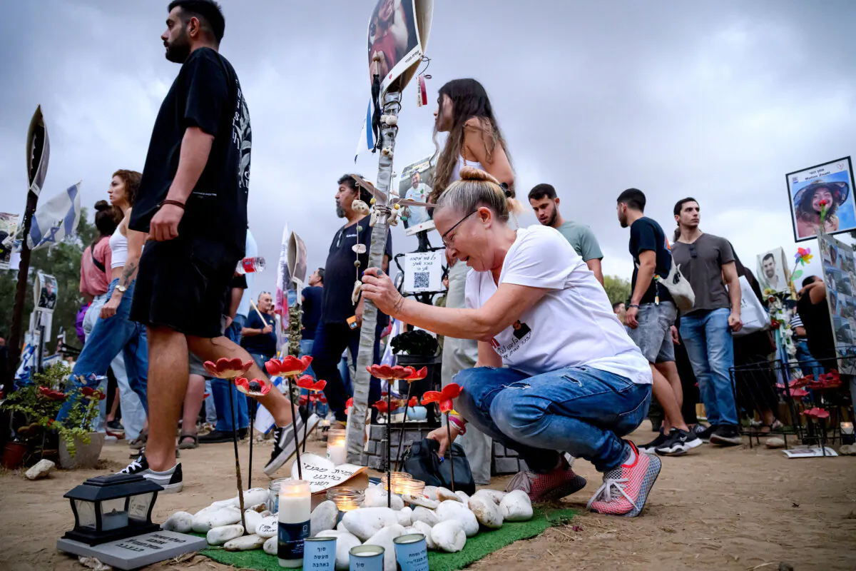 A woman breaks down at the memorial to Amit Magnezi as family members and friends of the lost and kidnapped gather at the site of the Nova Festival to mark the one year anniversary of the attacks by Hamas, in Re'im, Israel, on Oct. 7, 2024. (Leon Neal/Getty Images)