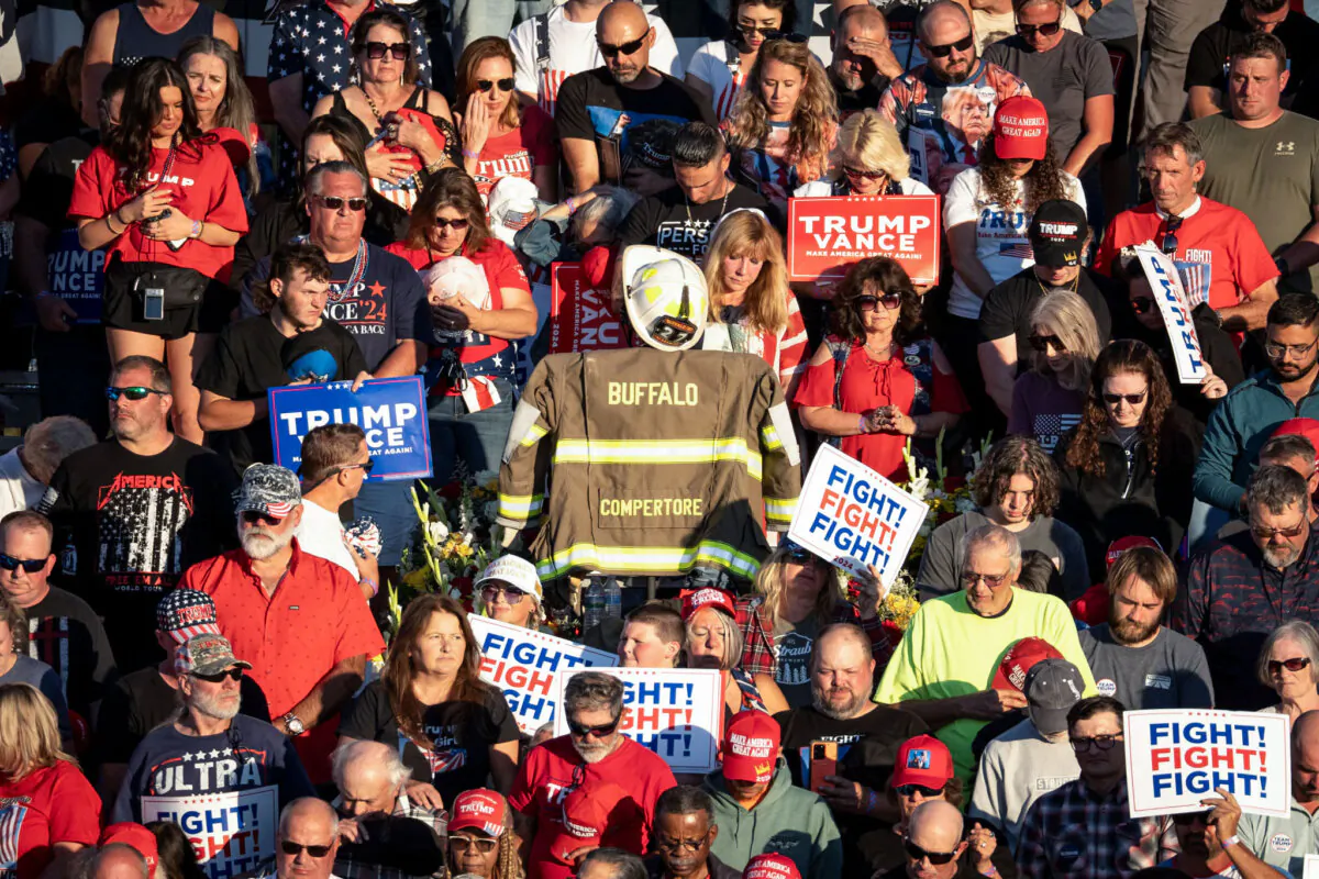 A firefighter's turnout gear sits near the spot where Corey Comperatore, a retired firefighter, was killed on July 13 during an attempted assassination on Republican presidential nominee, former President Donald Trump, during a campaign rally at the Butler Farm Show grounds in Butler Township, Pa., on Oct. 5, 2024. (Samira Bouaou/The Epoch Times)