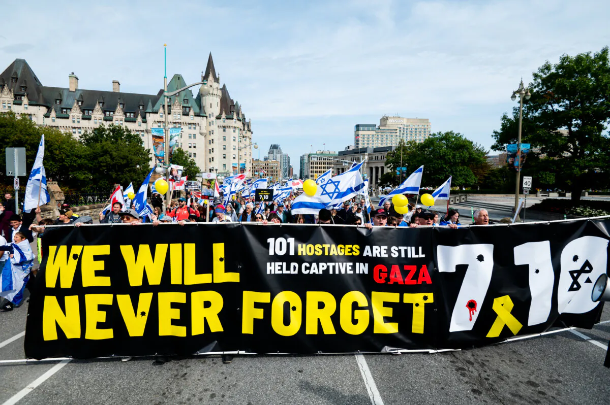 Protesters in support of Israel march towards Parliament Hill during a ceremony in Ottawa on Oct. 6, 2024. Monday marks one year since the attack on Israel by terrorist group Hamas. (The Canadian Press/Spencer Colby)