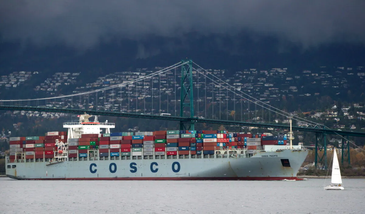 A Chinese container ship passes under the Lions Gate Bridge before docking at the Port of Vancouver in a file photo. (The Canadian Press/Darryl Dyck) 