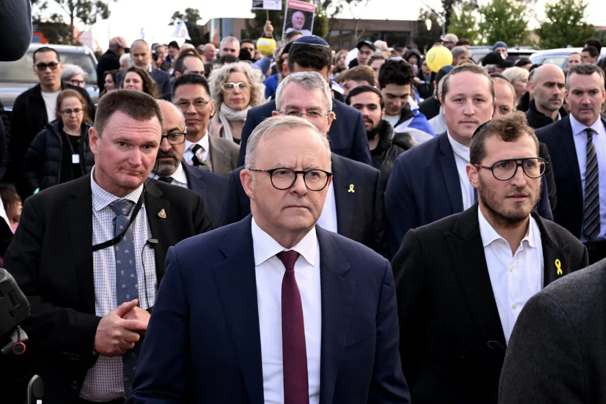 Australia's Prime Minister Anthony Albanese (C) walks with members of the Melbourne Jewish community during a vigil held on the first anniversary of the Israel-Hamas conflict, in Melbourne, Australia on Oct. 7, 2024. (William West/AFP via Getty Images)