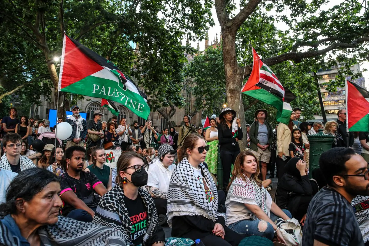 People attend a vigil outside Sydney’s Town Hall in New South Wales, Australia on Oct. 7, 2024. (Roni Bintang/Getty Images)