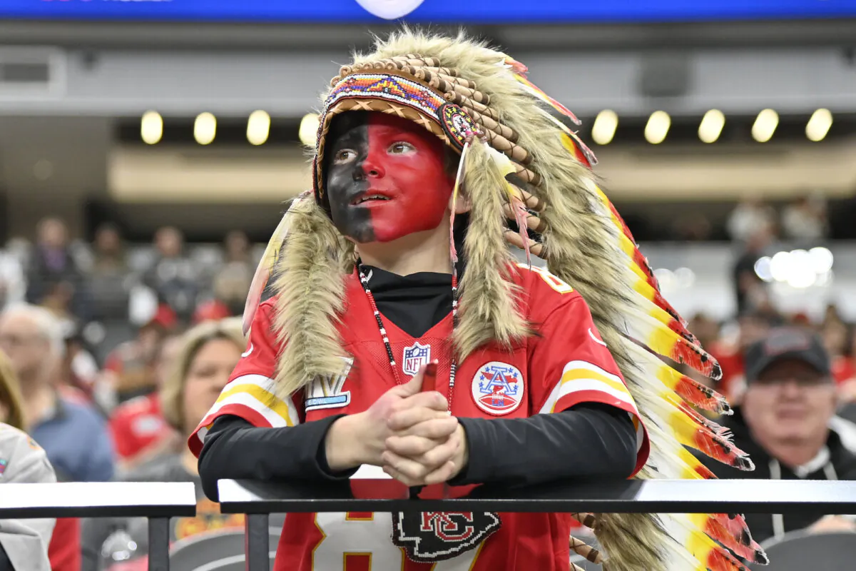 A young Kansas City Chiefs fan, dressed with a headdress and face paint, looks on during an NFL football game against the Las Vegas Raiders, on Nov. 26, 2023, in Las Vegas. (David Becker/AP Photo)