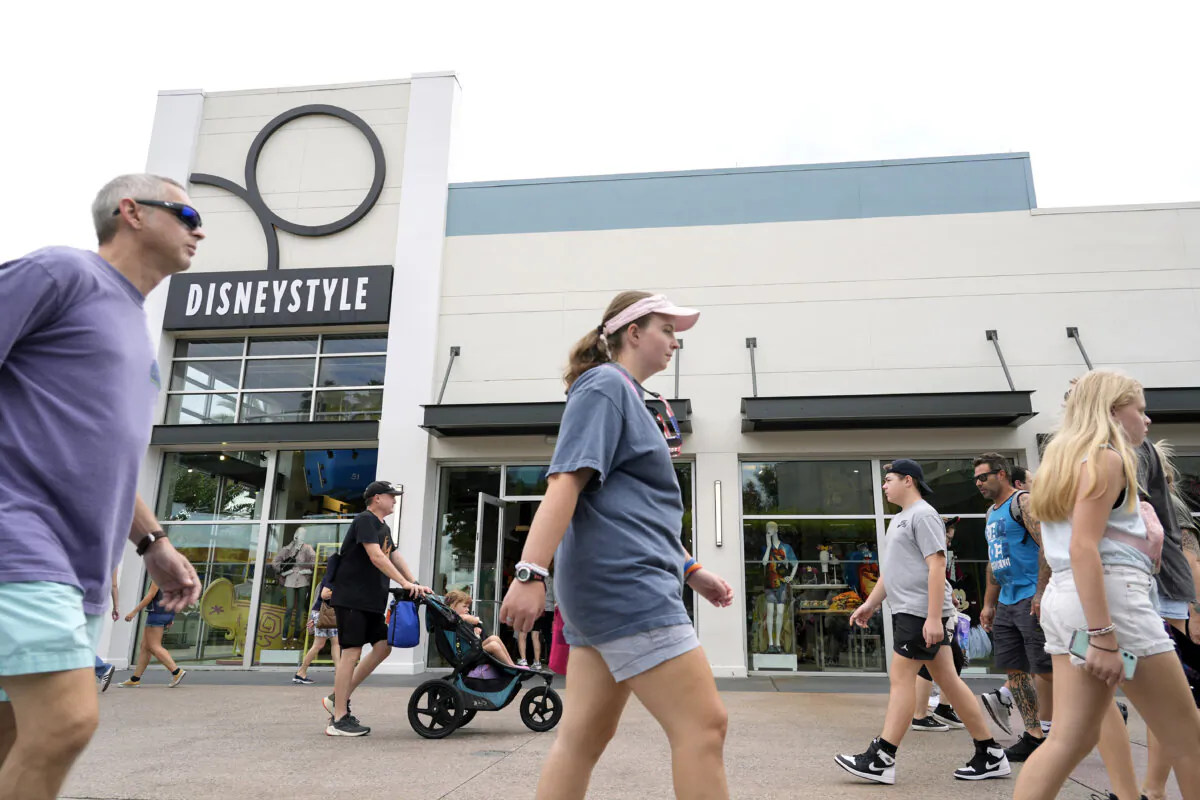 Calm weather greets tourists strolling past the various shops at the Disney Springs entertainment complex as Hurricane Milton threatens Florida in Lake Buena Vista, Fla., on Oct. 8, 2024. (John Raoux/AP Photo)