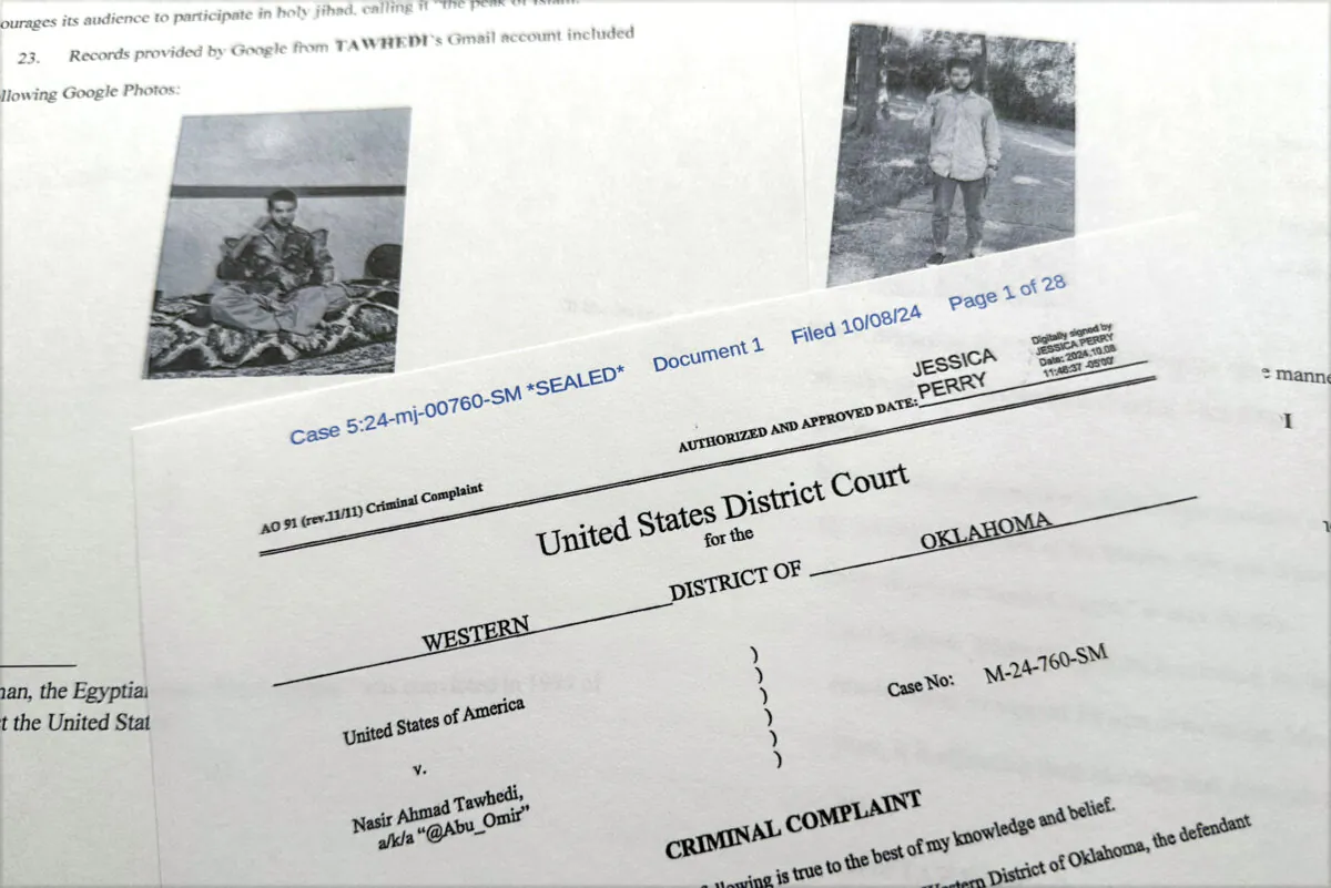 The criminal complaint, filed by the Justice Department, against Nasir Ahmad Tawhedi, 27,of Oklahoma City is photographed on Oct. 8, 2024, after the FBI arrested the man who officials say was inspired by the ISIS terrorist group and was plotting an Election Day attack targeting large crowds in the United States. (Jon Elswick/AP Photo)
