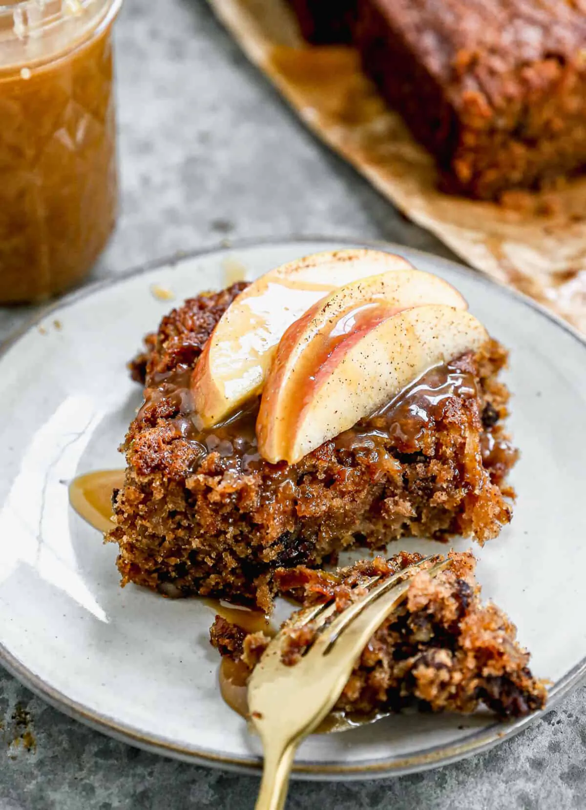 The delicious moist spice cake is made with grated apples, then served with a simple caramel sauce and scoop of ice cream. (Lauren Allen)