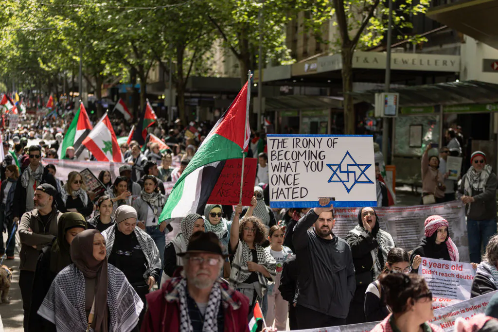 Pro-Palestine supporters march towards Flinders Street Station during an organised protest in commemoration of the anniversary of the war on Gaza on October 06, 2024 in Melbourne, Australia. (Diego Fedele/Getty Images)