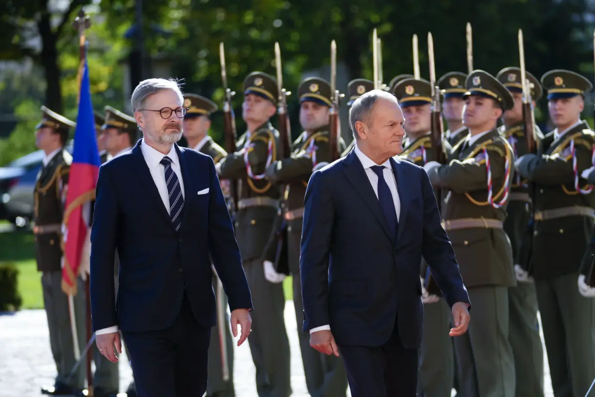 Czech Prime Minister Petr Fiala (L) welcomes Polish Prime Minister Donald Tusk as they meet in Prague on Oct. 9, 2024. (AP Photo/Petr David Josek)