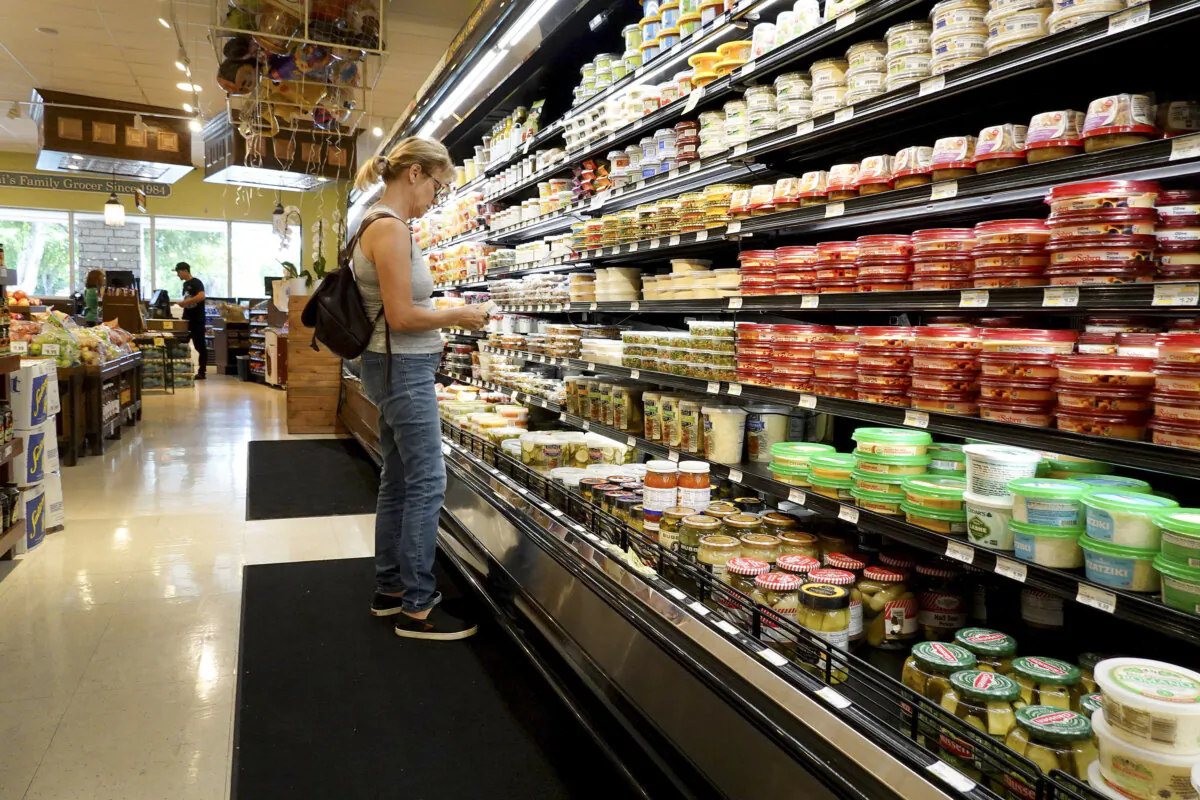 A shopper makes her way through a grocery store in Miami on July 12, 2023. (Joe Raedle/Getty Images)