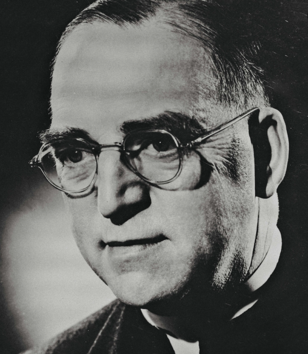 priest wearing glasses in "Heart of a Servant - The Father Flanagan Story."
