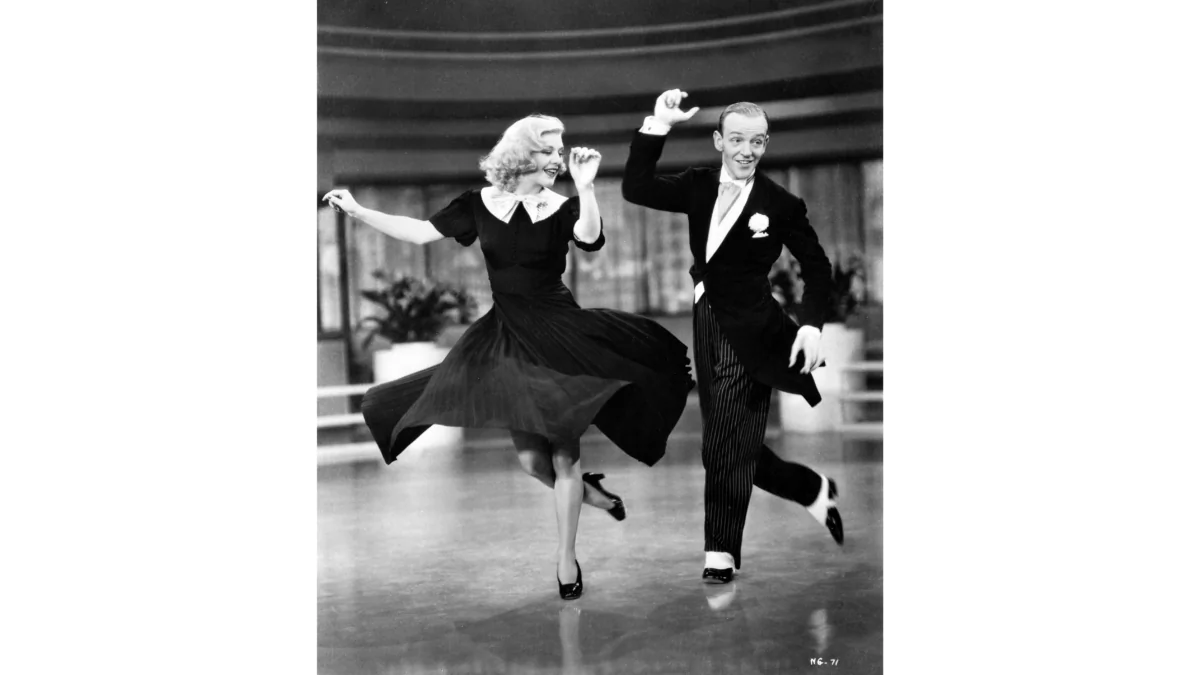 Penny Carrol (Ginger Rogers) swings with Lucky Garnett (Fred Astaire), in “Swing Time.” (MovieStillsDB)