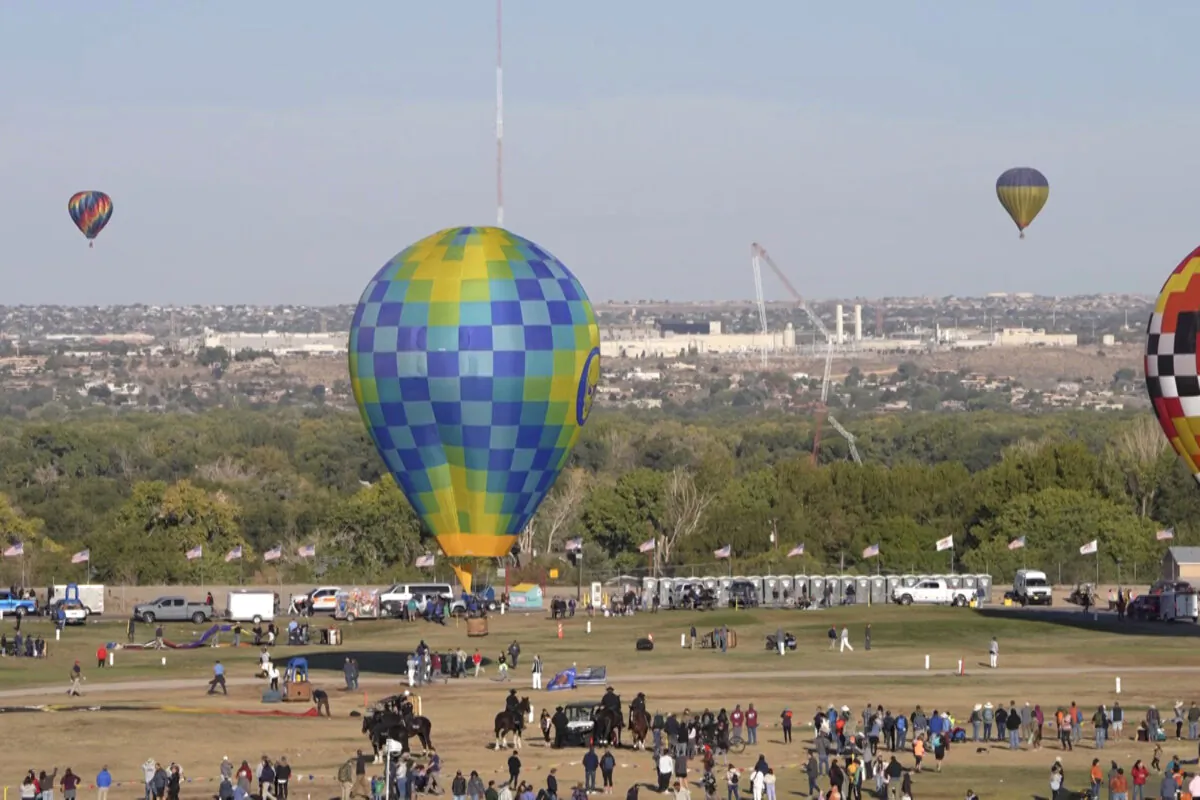 A radio tower collapses after a hot-air balloon struck it during the famous festival in Albuquerque, N.M., on Oct. 11, 2024. (Curt Fargo via AP)