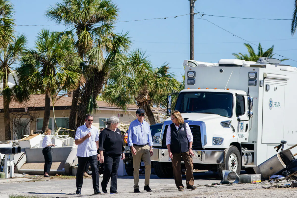 President Joe Biden 
(2nd R) and FEMA Administrator Deanne Criswell (R) survey debris in the aftermath of Hurricane Milton in St. Pete Beach, Fla., on Oct. 13, 2024. (Bonnie Cash/AFP via Getty Images)