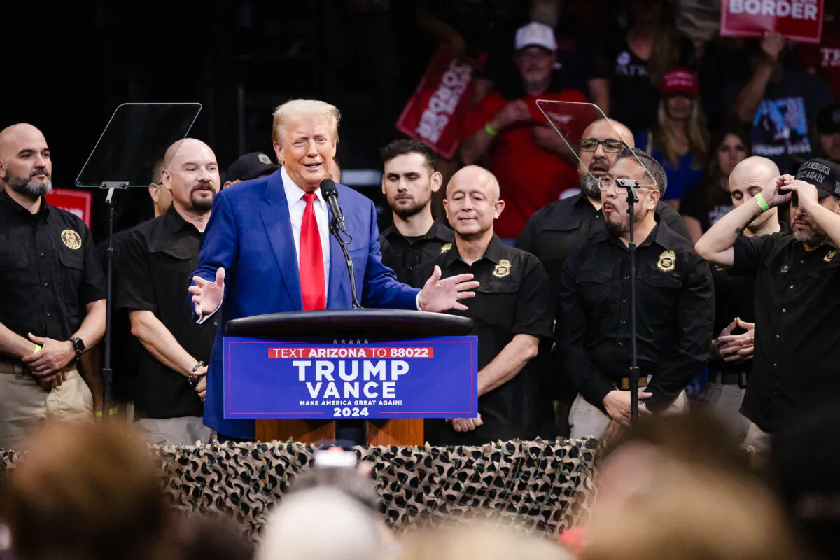 Republican presidential nominee, former President Donald Trump speaks next to National Border Patrol Council members during a campaign rally in Prescott Valley, Ariz., on Oct. 13, 2024. The National Border Patrol Council endorsed Donald Trump for President. (John Fredricks/The Epoch Times)