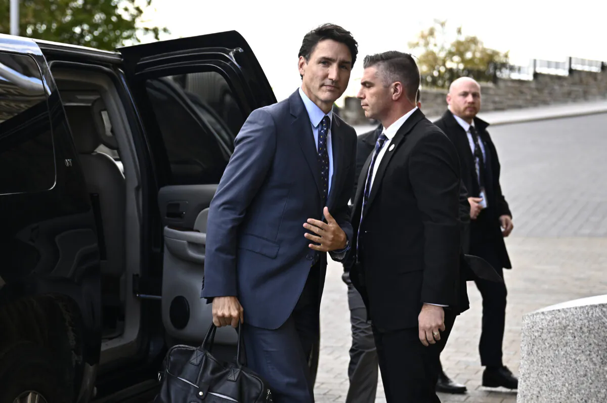 Prime Minister Justin Trudeau exits his vehicle as he arrives for a news conference on Parliament Hill in Ottawa, on Oct. 14, 2024. (The Canadian Press/Justin Tang)