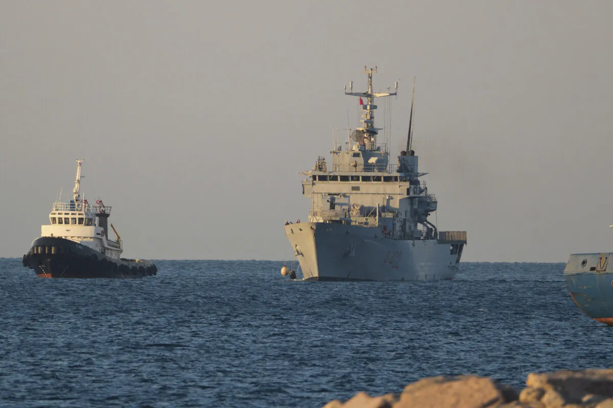 The Italian navy ship Libra carrying the first group of migrants, who were intercepted in international waters, arrives at the port of Shengjin, Albania, on Oct. 16, 2024. (AP Photo/Vlasov Sulaj)