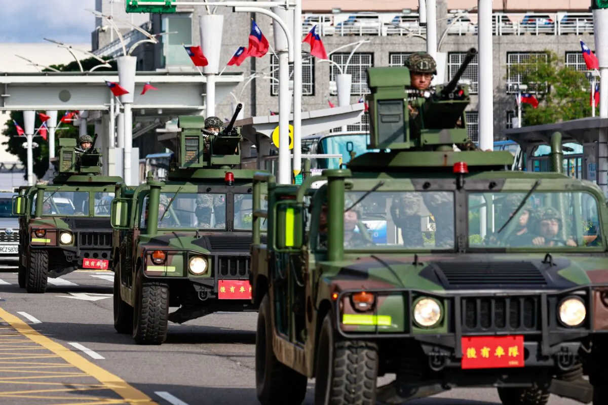 Armed military vehicles patrol outside the Songshan Airport in Taipei, Taiwan, on Oct. 14, 2024. (Daniel Ceng/AFP via Getty Images)