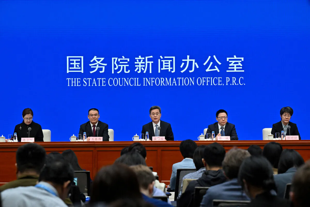 China's Finance Minister Lan Fo'an (C) speaks next to Vice Minister of Finance Wang Dongwei (2nd-L), Vice Minister of Finance Liao Min (2nd-R) and Vice Minister of Finance Guo Tingting (R) during a press conference in Beijing, on Oct. 12, 2024. (Adek Berry/AFP via Getty Images)