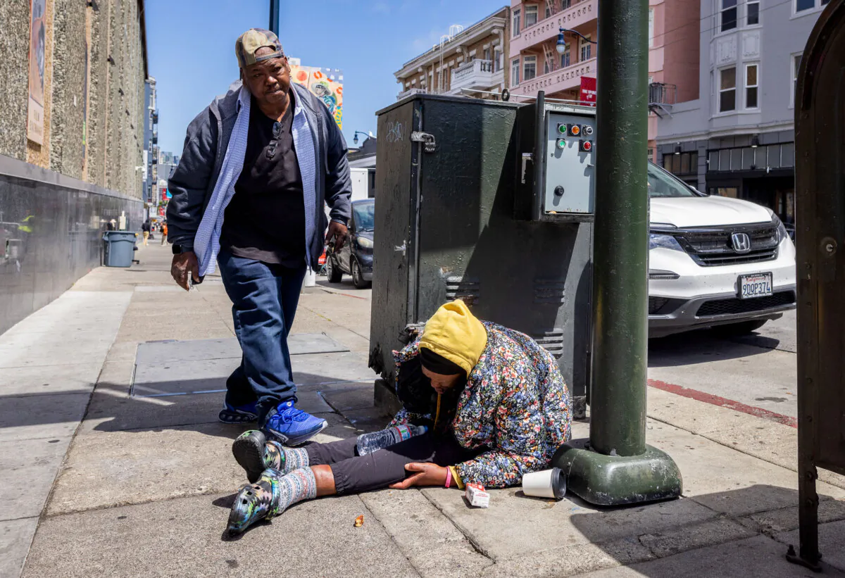 Retired chef JJ Smith, a Tenderloin resident whose brother died of an overdose, checks on the well-being of homeless drug addicts in the Tenderloin District of San Francisco, on May 16, 2024. (John Fredricks/The Epoch Times)