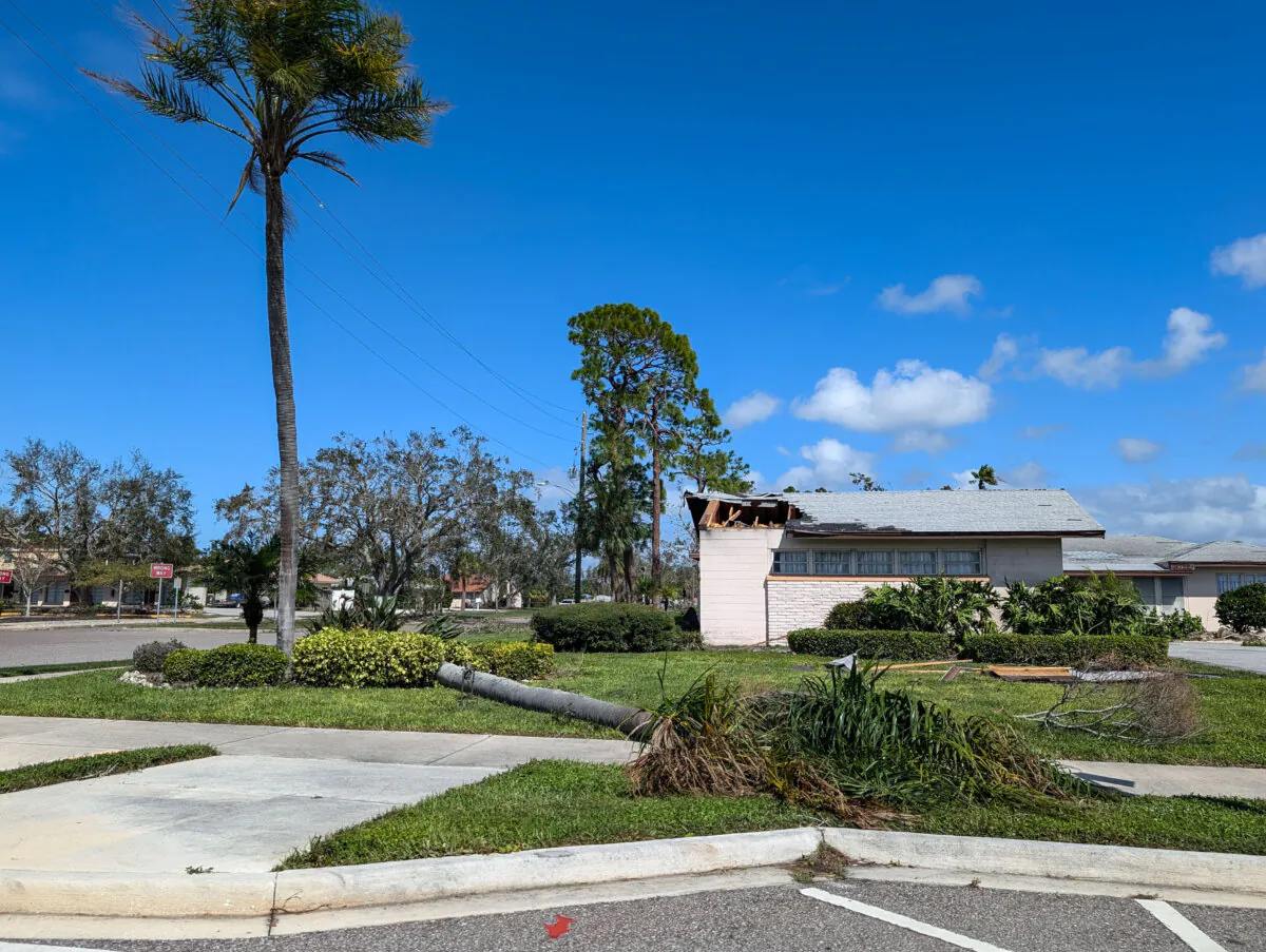 A building in Venice, Florida, sustained significant roof damage from Hurricane Milton on Oct. 10, 2024. (Jacob Burg/The Epoch Times)