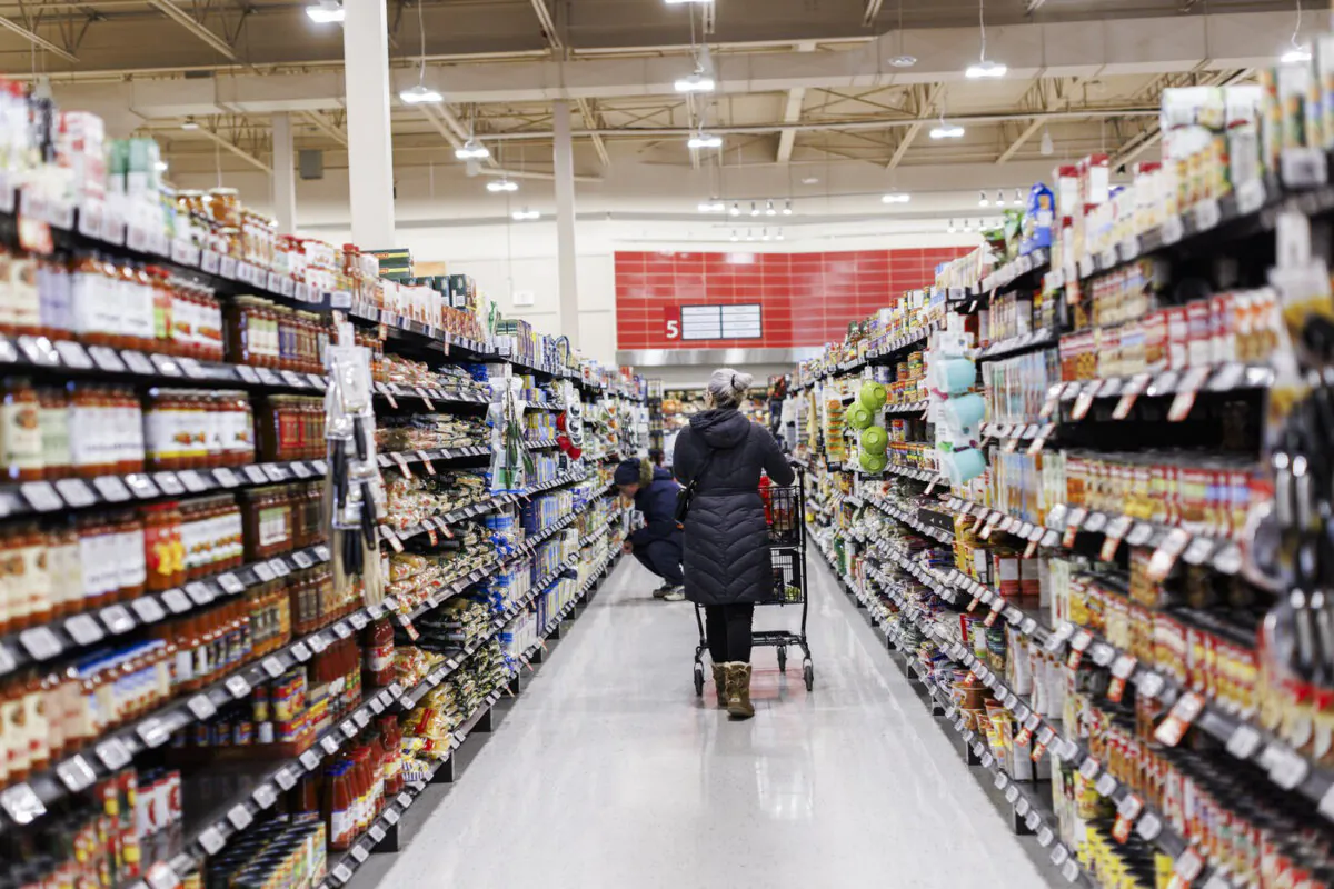 A shopper browses in an aisle at a grocery store In Toronto on Feb. 2, 2024. (The Canadian Press/Cole Burston)