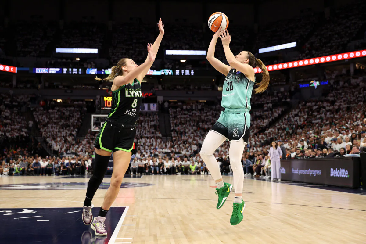 Sabrina Ionescu #20 of the New York Liberty shoots the ball against Alanna Smith #8 of the Minnesota Lynx during the fourth quarter in Game Three of the WNBA Finals at Target Center in Minneapolis on Oct. 16, 2024. (David Berding/Getty Images)