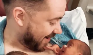 Newborn Baby Opens a Huge Smile to Greet Daddy