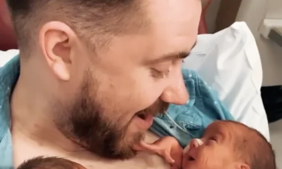 Newborn Baby Opens a Huge Smile to Greet Daddy