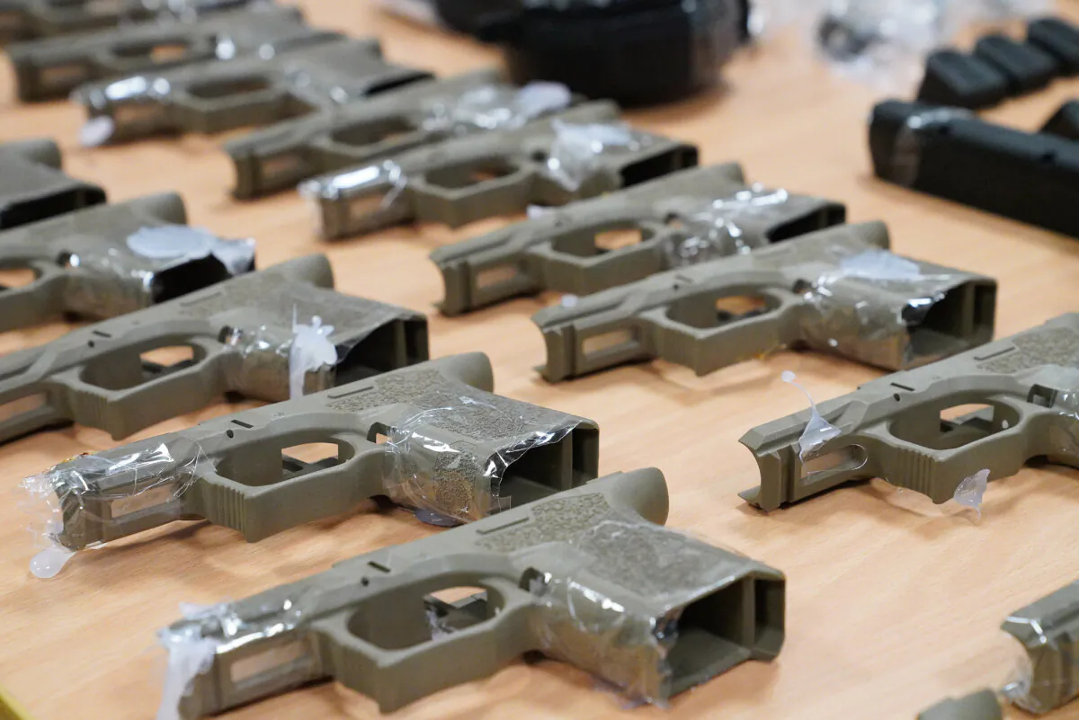 Seized gun parts are seen on display during a press conference at AFP Headquarters in Melbourne, Australia, on Jan. 29, 2019. (AAP Image/Stefan Postles)